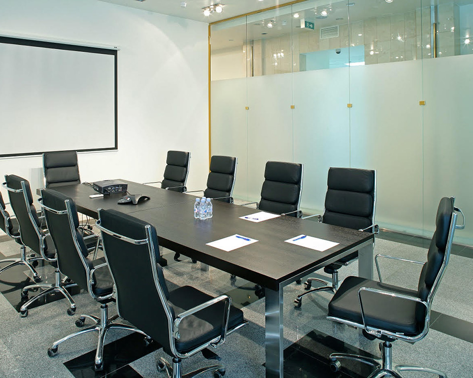 Light padded executive chairs around a boardroom table as boardroom chairs