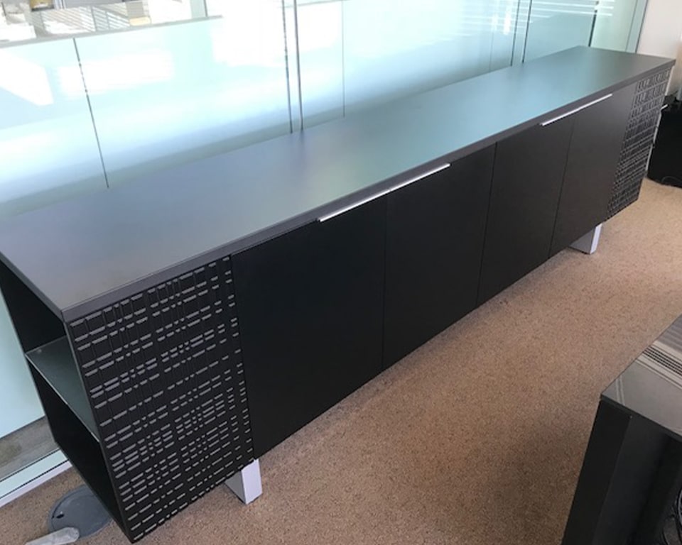Long Modi sideboard in matt black lacquered with open bookcase ends and glass shelves