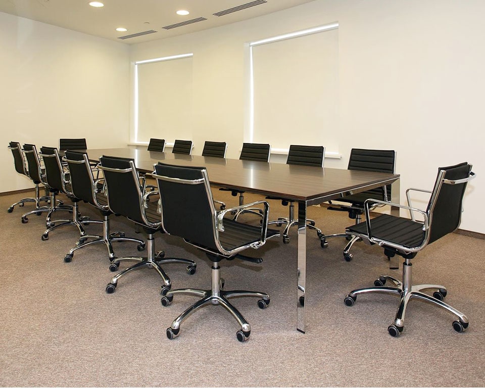 Low back luxury boardroom chairs in black and white leather - Die cast aluminium arms and 5 star base. Gas lift and tilt.