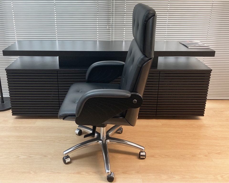 High quality High back executive chair with upholstered buttons in high grade Italian leather with Black As wood shell and 5 star base with castors, gas lift and tilt