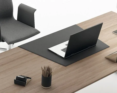 L- shaped managers desk with a leather desk pad