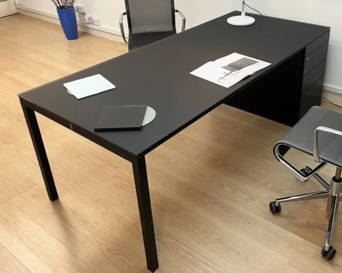 High quality black executive desk with a black glass desk top