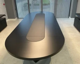 large d ended boardroom table in black ash wood and leather