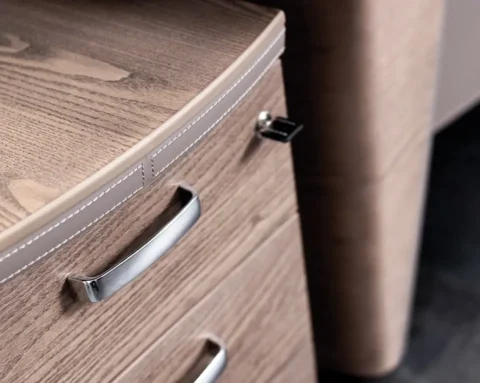 Exquisite saddle stitched leather detailing on the mobile pedestal