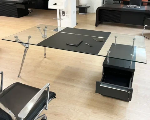 Large executive desk with a clear glass desk top