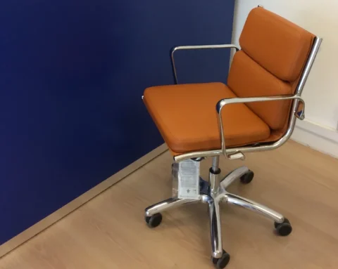 Tan leather executive chair with a medium high back