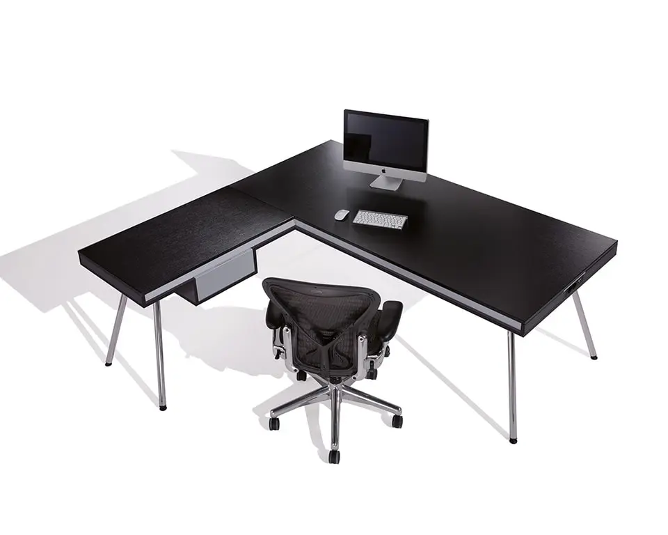 l- shaped black designer desk with a small drawer