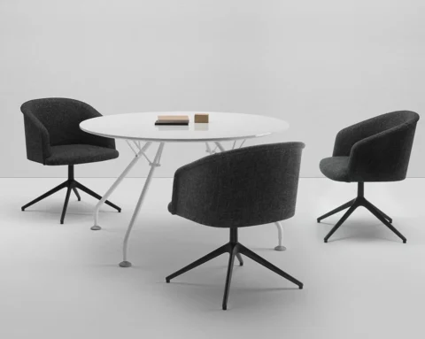 A high end round meeting table in white to seat 4 people