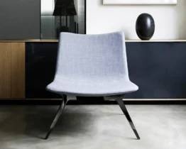 stunning occasional arm chair in blue fabric with a black base