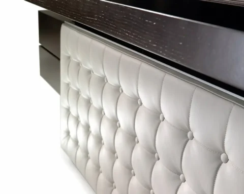 Executive desk with a white leather front modesty panel