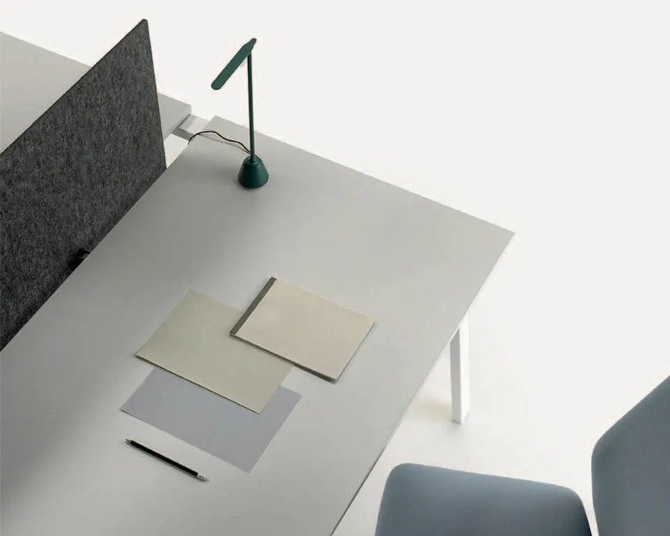white office desks with grey fabric screen dividers