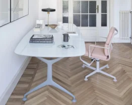 white glass oval shaped table with white legs