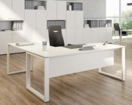 white l-shaped office desks with a modesty panel added