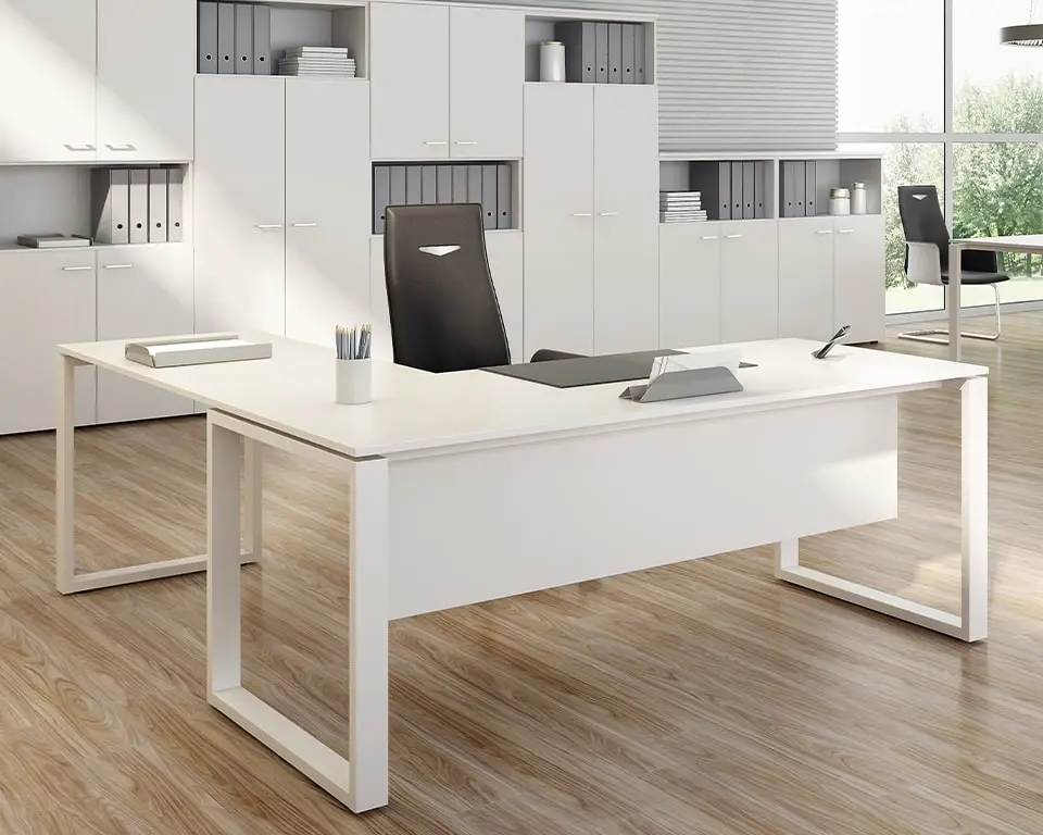 white l-shaped office desks with a modesty panel added