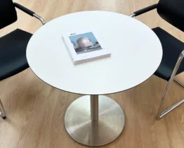a very good quality white round table in hpl and stainless steel
