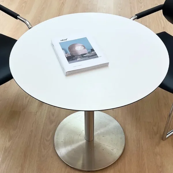 A very good quality white round table in HPL and Stainless steel